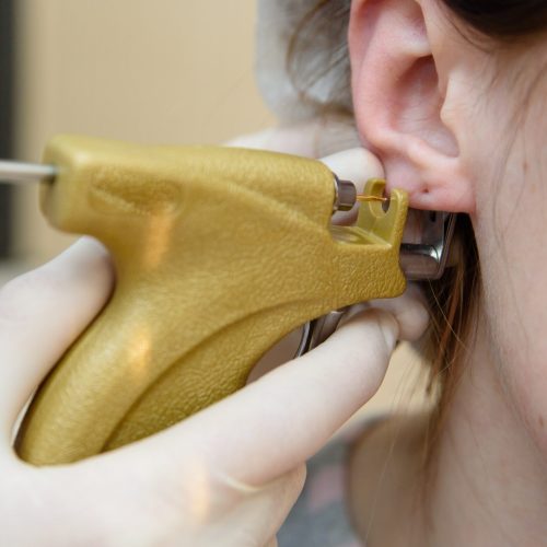 Ear piercing to piercing.